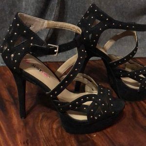 Black heals with gold balls on them